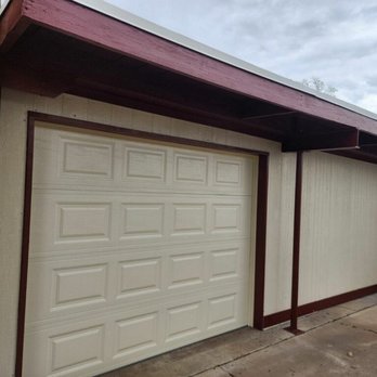 Painter ECol - The garage door trim and wood overhang was painted - Painters Near Me