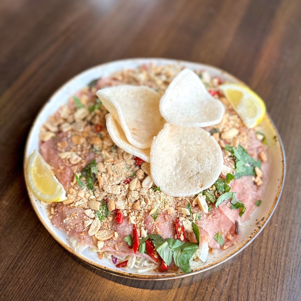 XO Bistro - a plate of food on a table - Vietnamese Near Me - Edmonton, Alberta XO Bistro - a plate of food on a table - Vietnamese Near Me - Edmonton, Alberta
