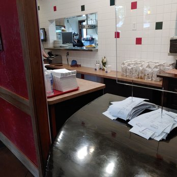 La Frontera - a kitchen with a counter, sink, and mirror - Mexican Near Me - Midvale, Utah
