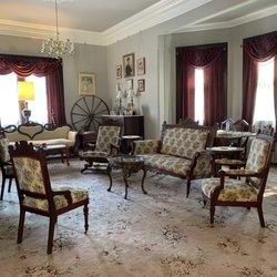 The Dominion House - Main parlor room with original 19th century furniture