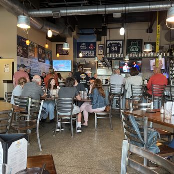 Panzanellas - people sitting at tables in a restaurant - Pizza Near Me - Newmarket, New Hampshire Panzanellas - people sitting at tables in a restaurant - Pizza Near Me - Newmarket, New Hampshire
