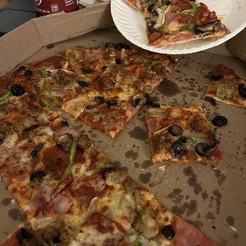 Domino's Pizza - a half eaten pizza in a box - Pizza Near Me - North Platte, Nebraska Domino's Pizza - a half eaten pizza in a box - Pizza Near Me - North Platte, Nebraska