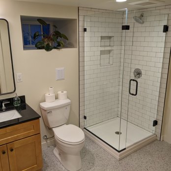 Trace Brash Construction - a bathroom with a toilet and shower - General Contractors Near Me