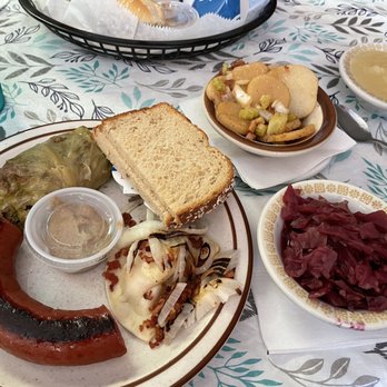 The Cabbage Roll - Variety plate with cabbage roll, pierogi, polish sausage, bread and you pick the sides. Red cabbage and hot German potato salad. - German Near Me - Saint Joseph, Missouri
