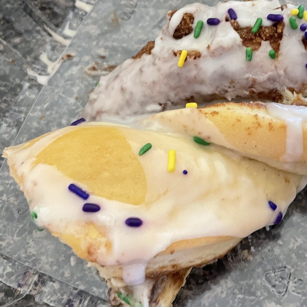Great Harvest Bread - One of their seasonal treats is king cake; you can buy by the slice or you can buy the whole cake with a variety of fillings. - Bakeries Near Me - Katy, Texas Great Harvest Bread - One of their seasonal treats is king cake; you can buy by the slice or you can buy the whole cake with a variety of fillings. - Bakeries Near Me - Katy, Texas
