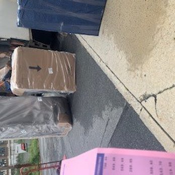 Ashley Store - showing how disorghanized these men were had to remove other order to get to mine and you can see things are not protected inside, - Furniture Stores Near Me - Quakertown, Pennsylvania
