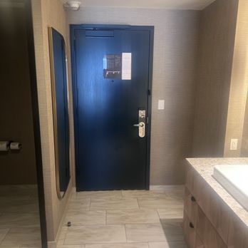 The Otis Hotel Austin, Autograph Collection - Room entry door in the bathroom - Hotels Near Me - Austin, Texas The Otis Hotel Austin, Autograph Collection - Room entry door in the bathroom - Hotels Near Me - Austin, Texas