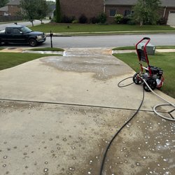 Rose Pressure Washing and Handyman Services - Before and after of driveway and front porch are and sidewalk of a residence in the Madison area.