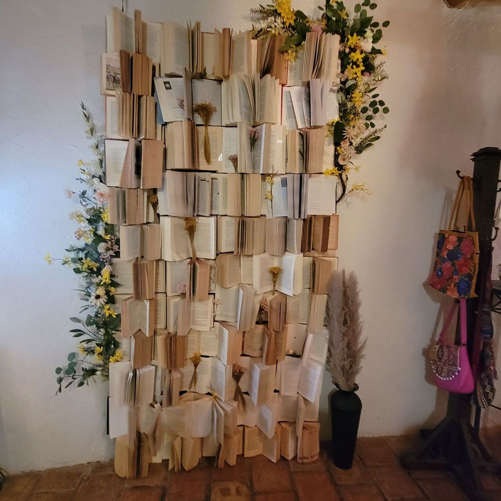 Wine Down - a wall of books stacked on top of each other - Wine Bars Near Me - Socorro, Texas Wine Down - a wall of books stacked on top of each other - Wine Bars Near Me - Socorro, Texas