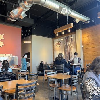 Maple Street Biscuit - people sitting at tables in a restaurant - Breakfast & Brunch Near Me - Lexington-Fayette, Kentucky