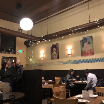 Issian - View of wall art and some seating + front door - Sushi Bars Near Me - Seattle, Washington Issian - View of wall art and some seating + front door - Sushi Bars Near Me - Seattle, Washington