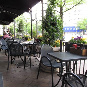 Elephant & Castle - outdoor dining area has umbrellas against sun and rain - British Near Me - Washington, DC, District of Columbia Elephant & Castle - outdoor dining area has umbrellas against sun and rain - British Near Me - Washington, DC, District of Columbia