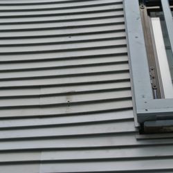 Storm Group Roofing - The second railing and open holes left from the removal of the first.