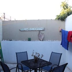 The Palace Hostel - Rooftop seating. Sorry, this picture doesn't show the broken glass and cigarette butts on the floor.