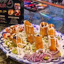 El Charro Mexican Restaurant & Bar - Happy Hour Monday- Friday 4pm-6 pm Taco dip. Taco dip on a bed of guacamole. We enjoyed this.