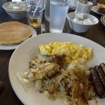 Top View - Hashbrowns, eggs, sausage with pancakes - Breakfast & Brunch Near Me - Chicago, Illinois Top View - Hashbrowns, eggs, sausage with pancakes - Breakfast & Brunch Near Me - Chicago, Illinois