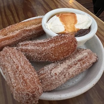 Terra Plata - churros + spiced chocolate + caramel + whipped cream - New American Near Me - Seattle, Washington Terra Plata - churros + spiced chocolate + caramel + whipped cream - New American Near Me - Seattle, Washington