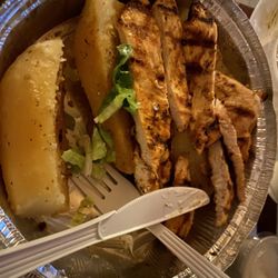 Greek Bites - Grilled chicken platter with divine lemon potatoes perfectly cooked fresh, also comes with a good size Greek salad & pita bread.