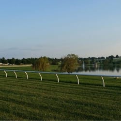 Donamire Farm - A view of the pond and fountain in the middle of one of the horse racing tracks.