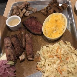 Platter with 4 meats, cheesy cauliflower, slaw, house made pickled veg.