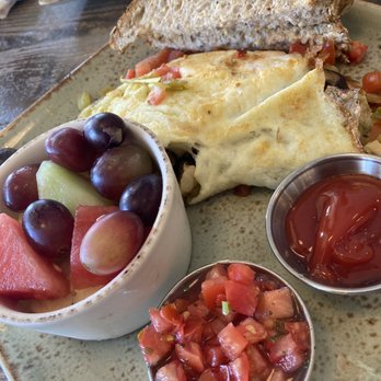 First Watch - Omelet was stuffed with tomatoes, on side some more chopped tomatoes and a side of ketchup - Breakfast & Brunch Near Me - Sunrise, Florida First Watch - Omelet was stuffed with tomatoes, on side some more chopped tomatoes and a side of ketchup - Breakfast & Brunch Near Me - Sunrise, Florida