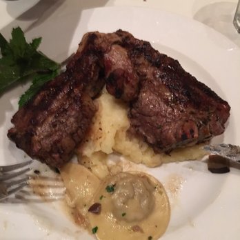 Becco - Porterhouse lamb chop on mashed with fresh mushroom ravioli - Italian Near Me - New York, New York Becco - Porterhouse lamb chop on mashed with fresh mushroom ravioli - Italian Near Me - New York, New York