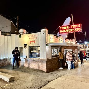 Town Topic - people standing outside of a restaurant at night - Burgers Near Me - Kansas City, Missouri Town Topic - people standing outside of a restaurant at night - Burgers Near Me - Kansas City, Missouri
