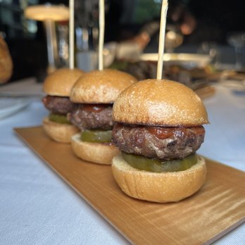 UN Plaza Grill - two burgers on a wooden board - Kosher Near Me - New York, New York