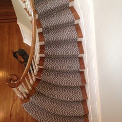 Redi-Cut Carpet & Rugs - Patterned wool carpeting installed as a runner on a curved flight of steps.