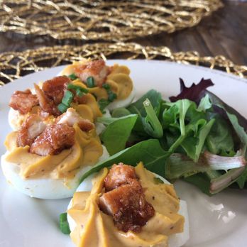 KitchenCray Cafe - Mumbo Deviled Eggs. Tradition Deviled Rggs topped with a piece of fried chicken dipped in Mumbo sauce. - Breakfast & Brunch Near Me - Lanham, Maryland
