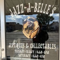 Jazz-A-Belle's - Store front door with hours