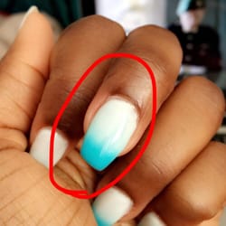 21 Nail Spa - Slanted nail. Not filed correctly, not the end of the world...but it shouldn't happen in a professional shop.