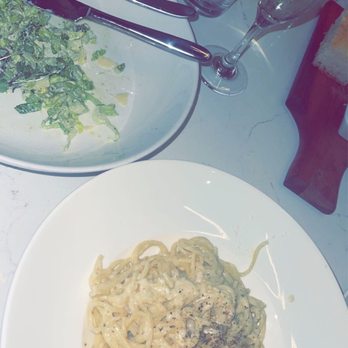 Taverna - Cheese wheel pasta and Caesar salad - Italian Near Me - Austin, Texas Taverna - Cheese wheel pasta and Caesar salad - Italian Near Me - Austin, Texas