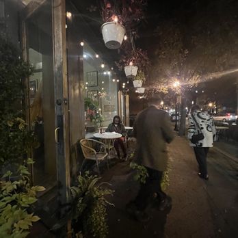 Marie Louise Bistro - Outdoor seating, small but surrounded with decoration that enhances the ambiance. - French Near Me - Baltimore, Maryland Marie Louise Bistro - Outdoor seating, small but surrounded with decoration that enhances the ambiance. - French Near Me - Baltimore, Maryland
