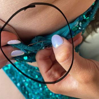 Marie's Touches of Class - Safety pin on chest part of dress due to unraveling and falling off chest - Bridal Near Me - Johnsburg, Illinois Marie's Touches of Class - Safety pin on chest part of dress due to unraveling and falling off chest - Bridal Near Me - Johnsburg, Illinois