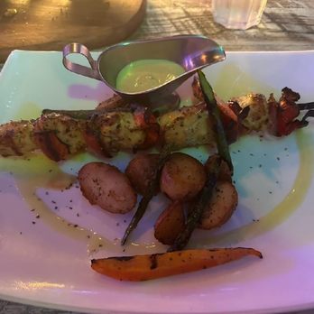 Poseidon - Thyme organic chicken souvlaki served with root vegetables - Greek Near Me - Miami Beach, Florida Poseidon - Thyme organic chicken souvlaki served with root vegetables - Greek Near Me - Miami Beach, Florida