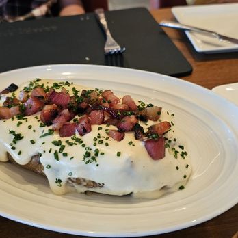 Gordon Ramsay Steak - Baked Potato with Gouda Topping and Lardons - Steakhouses Near Me - Westlake, Louisiana