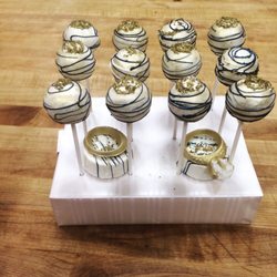 Custom Candyy - Cake pops for an engagement party. Edible chocolate wedding rings.