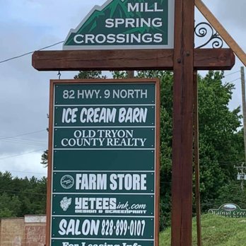 Mill Spring Farm Store - a sign for mill spring crossing - Specialty Food Near Me - Mill Spring, North Carolina
