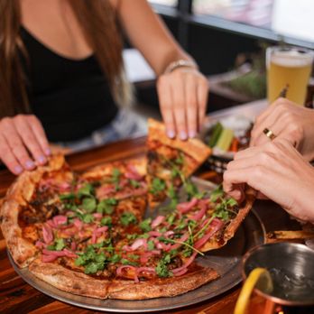 Pizza Beer & Jukebox - a group of people eating pizza - Pizza Near Me - Chicago, Illinois Pizza Beer & Jukebox - a group of people eating pizza - Pizza Near Me - Chicago, Illinois