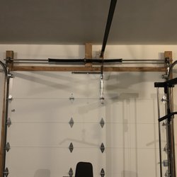 Roberts Garage Doors & Services - Motor rail had to be moved 6 inches to the left to prevent further damage to door. Opener is now attached properly with a bracket