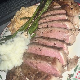 a plate of meat, mashed potatoes, and asparagus a plate of meat, mashed potatoes, and asparagus