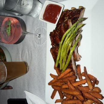 The SaltBox Cafe - Carolina bbq pork ribs with sweet potato fries and asparagus. - New American Near Me - Kill Devil Hills, North Carolina The SaltBox Cafe - Carolina bbq pork ribs with sweet potato fries and asparagus. - New American Near Me - Kill Devil Hills, North Carolina