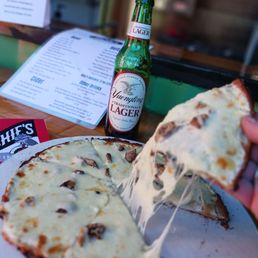 This was my special pizza created for me. Alfredo sauce, fresh mozzarella,  shredded mozzarella, mushrooms.