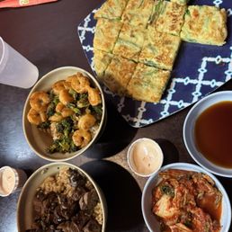 Steak & Mushroom Bowl, Shrimp & Broccoli Bowl, green onion pancake with pink sauce and a side of kimchi. Steak & Mushroom Bowl, Shrimp & Broccoli Bowl, green onion pancake with pink sauce and a side of kimchi.
