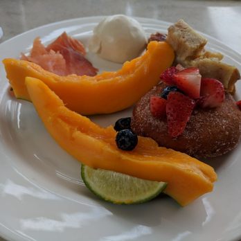 Ikena - Selections from the breakfast buffet - papaya, house-smoked salmon, char siu manapua, shrimp siu mai, malasadas - Buffets Near Me - Wailea-Makena, Hawaii Ikena - Selections from the breakfast buffet - papaya, house-smoked salmon, char siu manapua, shrimp siu mai, malasadas - Buffets Near Me - Wailea-Makena, Hawaii