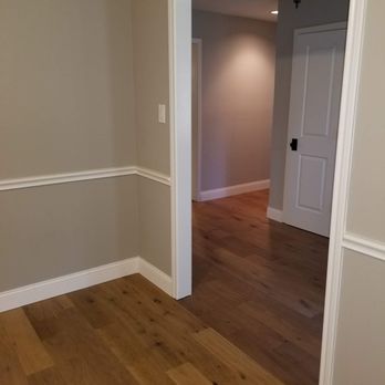 Ljs Flooring - Engineered hardwoods and baseboards installed throughout the house (baseboards not yet painted) - Flooring Near Me - Lewisville, Texas