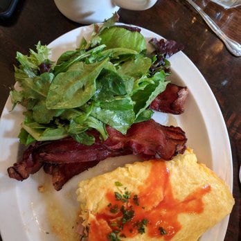 Toast - Ham cheddar omelet, side of bacon and greens. Delicious! - Breakfast & Brunch Near Me - New Orleans, Louisiana Toast - Ham cheddar omelet, side of bacon and greens. Delicious! - Breakfast & Brunch Near Me - New Orleans, Louisiana