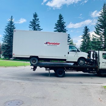 Quality Quick Towing Inc - Towing a Purolator Tru j. - Towing Near Me - Calgary, Alberta Quality Quick Towing Inc - Towing a Purolator Tru j. - Towing Near Me - Calgary, Alberta