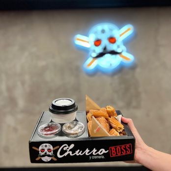 Churro Boss - a hand holding a box of churros - Desserts Near Me - Covina, California